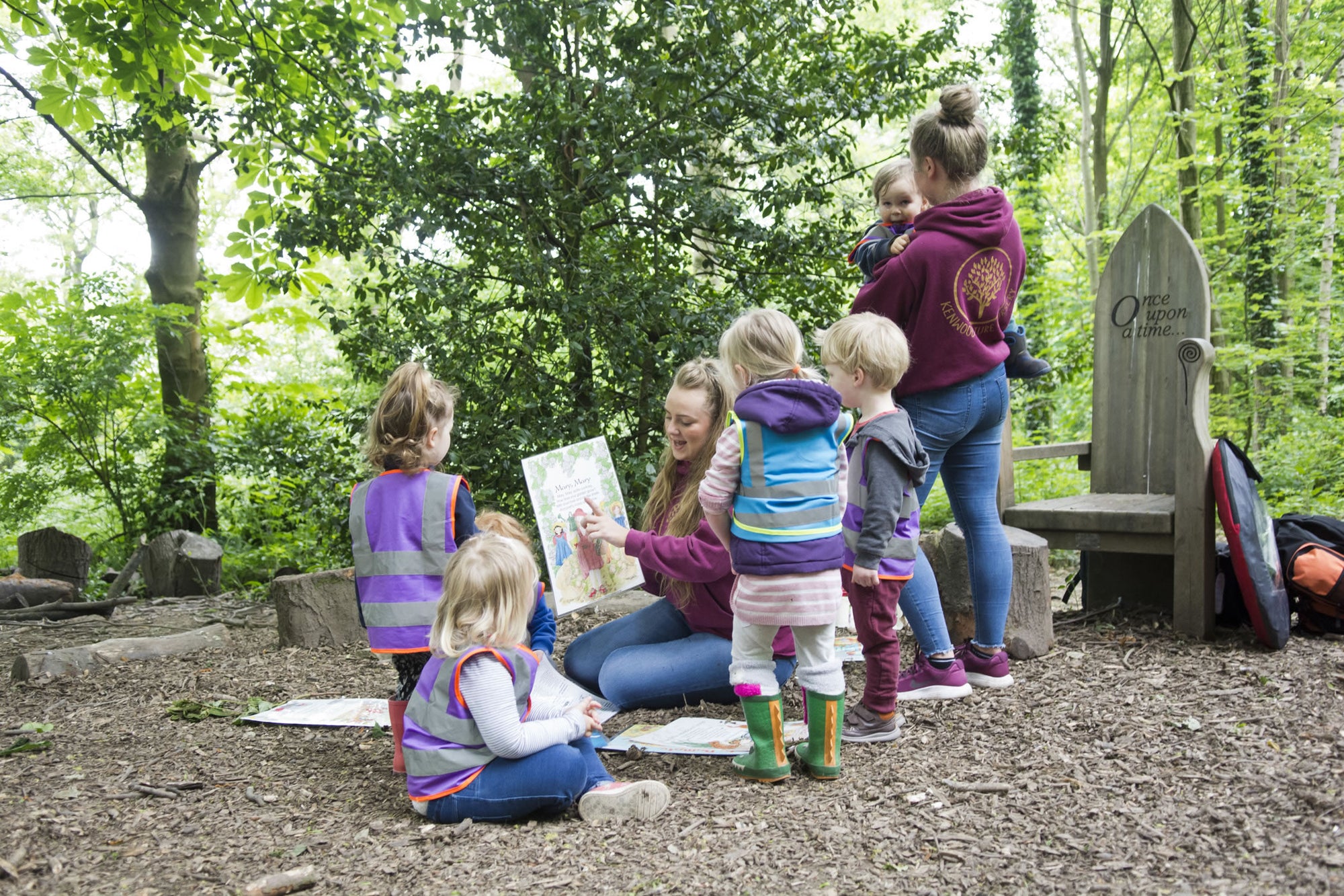 A child reading outdoors